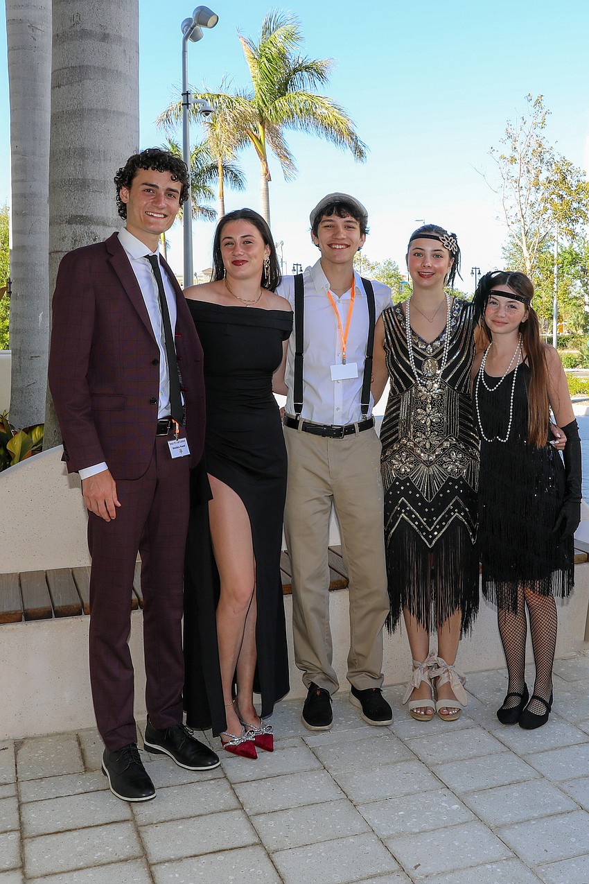 Maddox Powell, Caroline Ceaser, Ty Nykorchuck, Natalie Ceaser and Norah Ceaser volunteer at the Beaux Arts Ball on March 21.