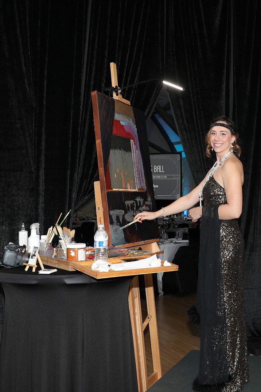 Maggie Bosco, a painting instructor at Art Center Sarasota, paints live at the Beaux Arts Ball.