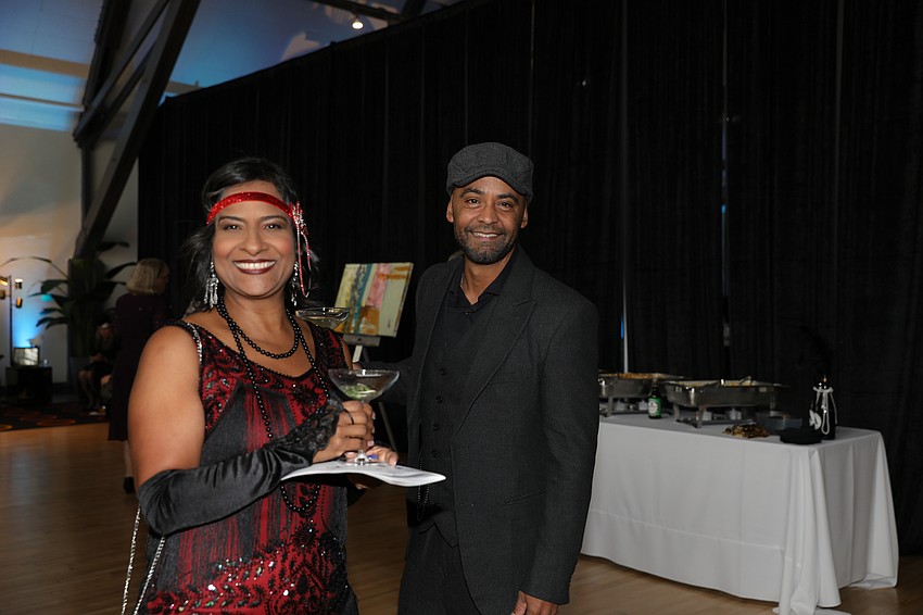 Betsy Dones and Javier Rodriguez enjoy the cocktail reception.