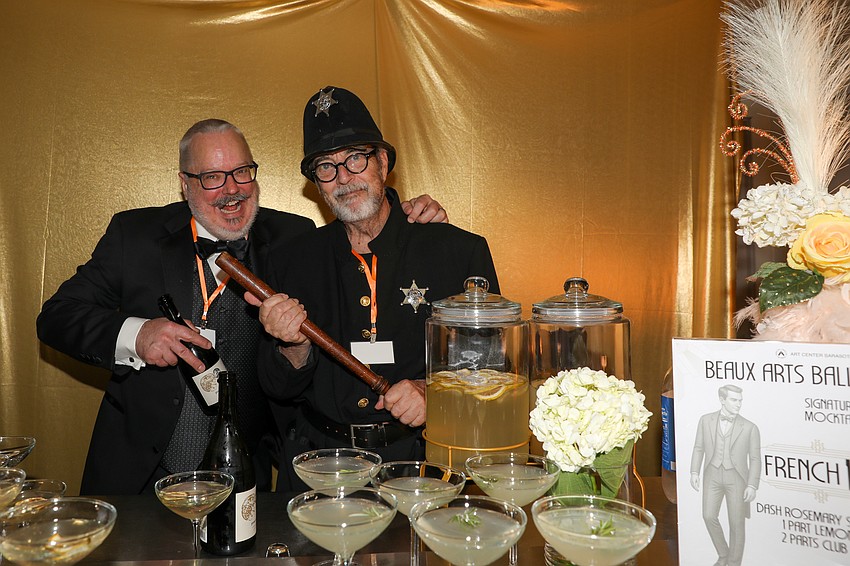 Chet Farmer and Joe Angers have fun behind the bar, and that Bobby stick was an important prop for Angers.