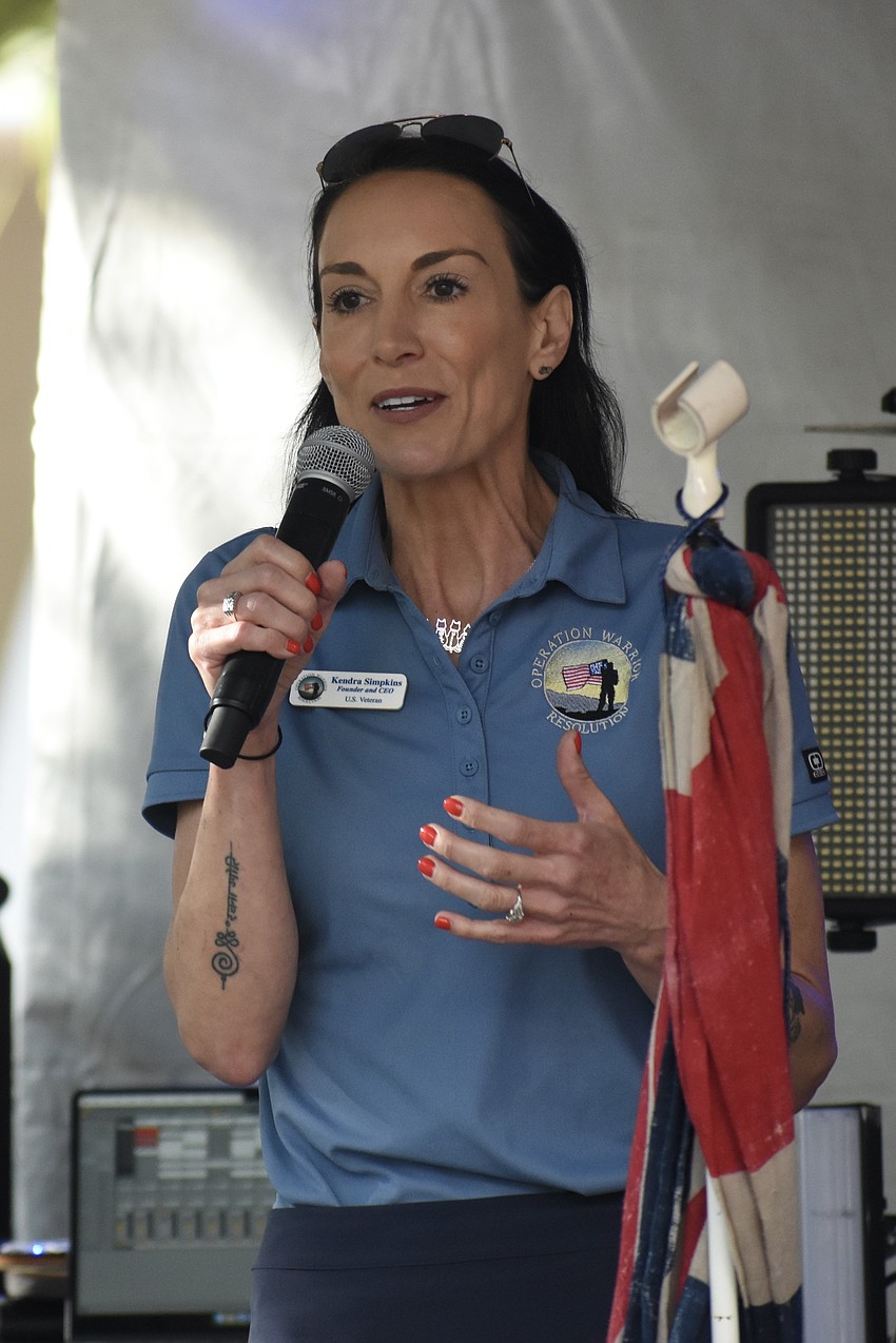 Kendra Simpkins, a U.S. Army veteran and the founder and CEO Of Operation Warrior Resolution, speaks during the event.