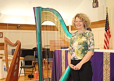 Tasha Robinson has played the harp for 35 years. On St. Patrick's Day, she performed with two of her instruments at All Angels by the Sea Episcopal Church before attendees enjoyed an Irish-themed holiday dinner.