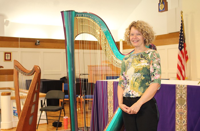 Tasha Robinson has played the harp for 35 years. On St. Patrick's Day, she performed with two of her instruments at All Angels by the Sea Episcopal Church before attendees enjoyed an Irish-themed holiday dinner.
