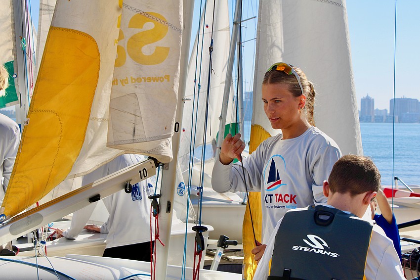 Kate McCarthy, one of the youth mentors with the new Next Tack youth sailing program partnership between Spectrum Sailing and the Sarasota Sailing Squadron, readies to set sail at the end-of-season regatta March 21 on Sarasota Bay.