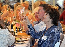 Deborah DiCarlo and approximately 150 fellow celebrants raise a glass to toast Longboat Island Chapel's 70th anniversary. Attendees shared memories and cake at the festivities March 22 at Shook Hall.