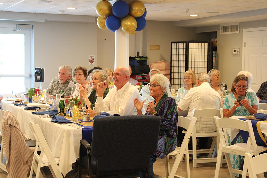 Celebrants including Connie DiMaggio, front, take in the live music and fun at the 70th anniversary.