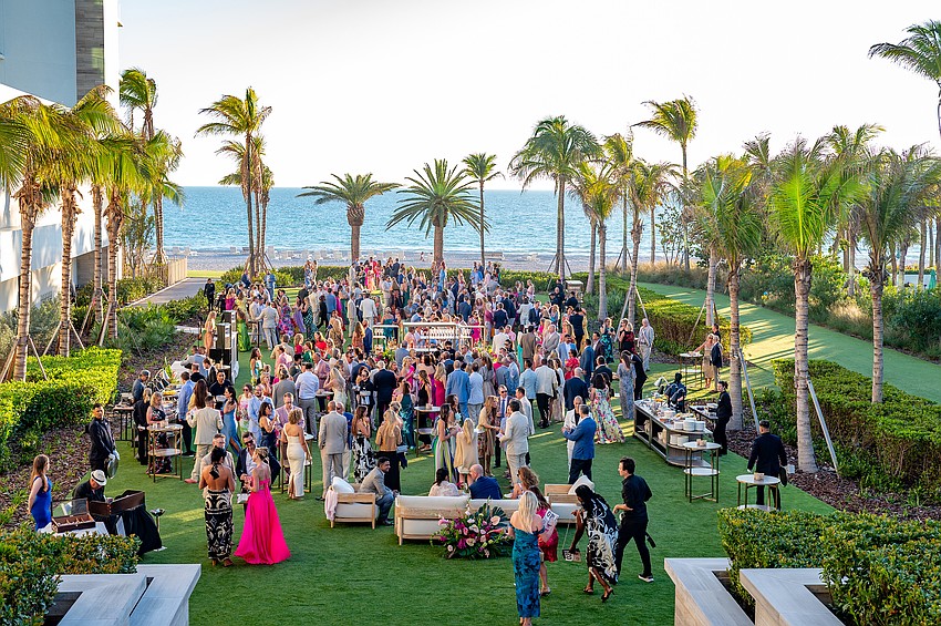 Guests enjoy cocktails, music and hors d'oeuvres in the courtyard before dinner.
