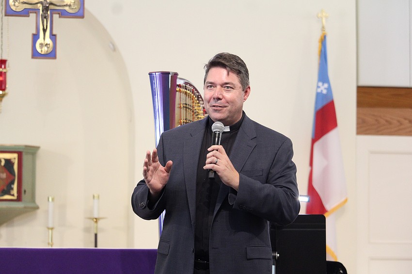 Rev. David Marshall welcomes attendees to the St. Patrick's Day concert and dinner at All Angels by the Sea Episcopal Church.