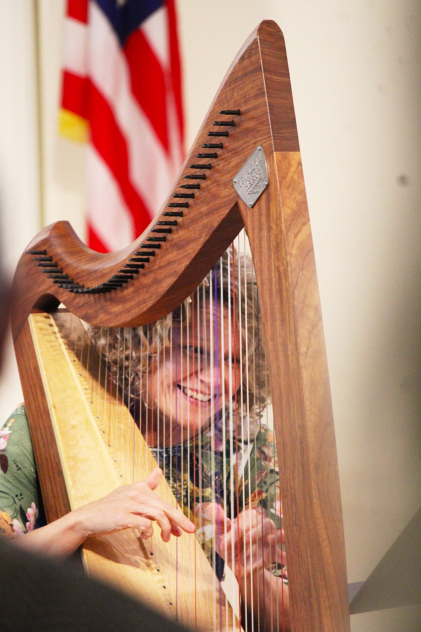 A perpetual smile remained fixed on Tasha Robinson's face as she played her harp.