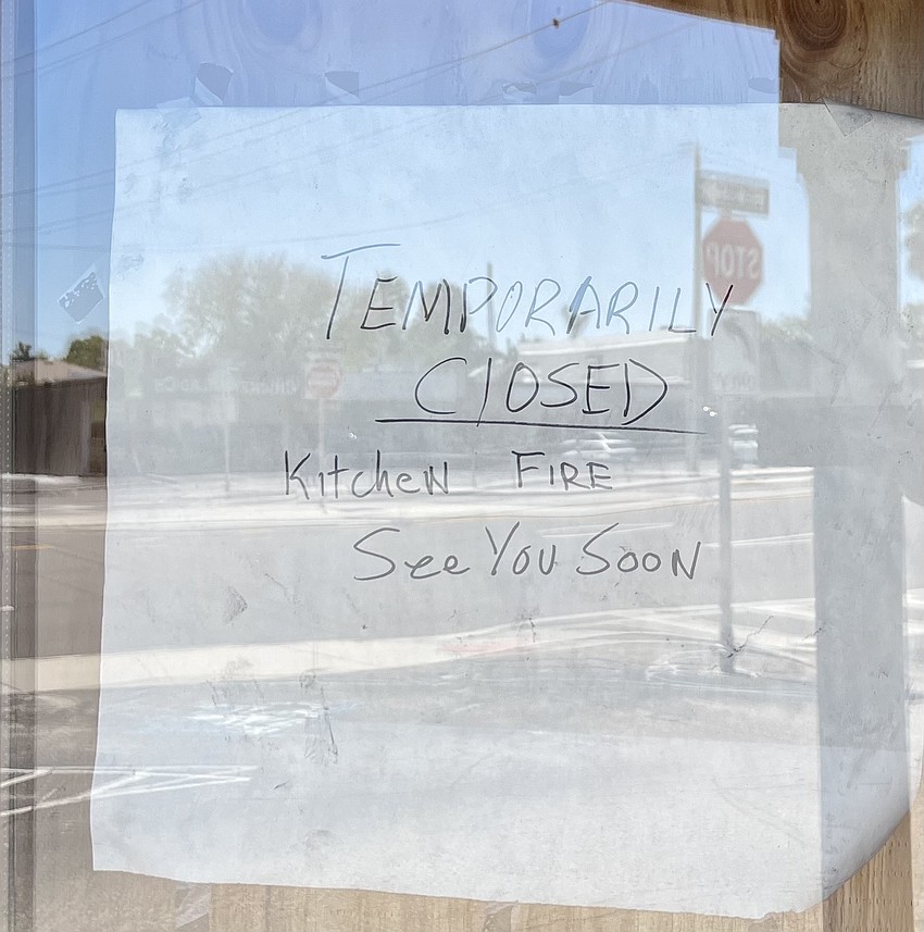 A sign posted on the door of Jimbo's Pit Bar B-Q March 22.