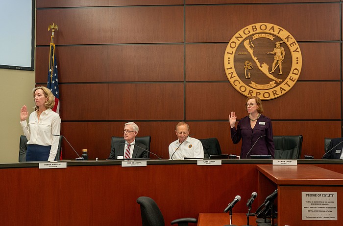 Debra Williams (standing left) and Penny Gold (standing right) were picked as mayor and vice mayor, respectively, at Longboat Key’s Town Commission meeting Monday, March 23.