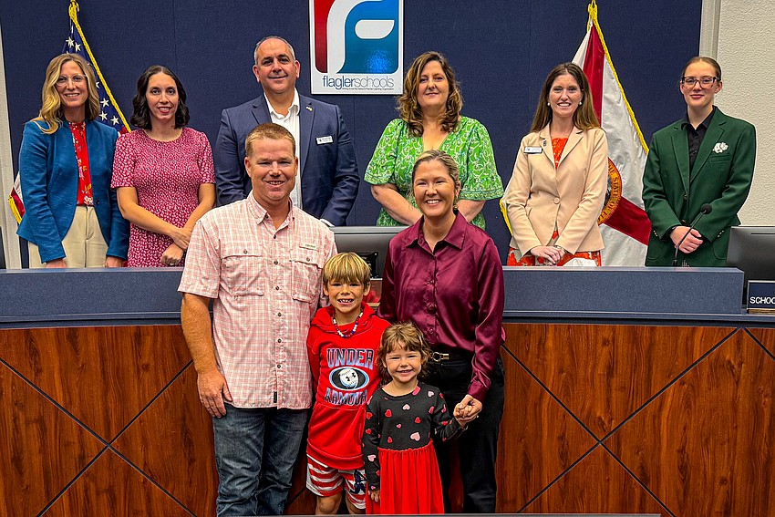 Lauren Johnston with her husband, CJ, and children Cole and Maddie with the Flagler County School Board. Photo courtesy of Flagler Schools