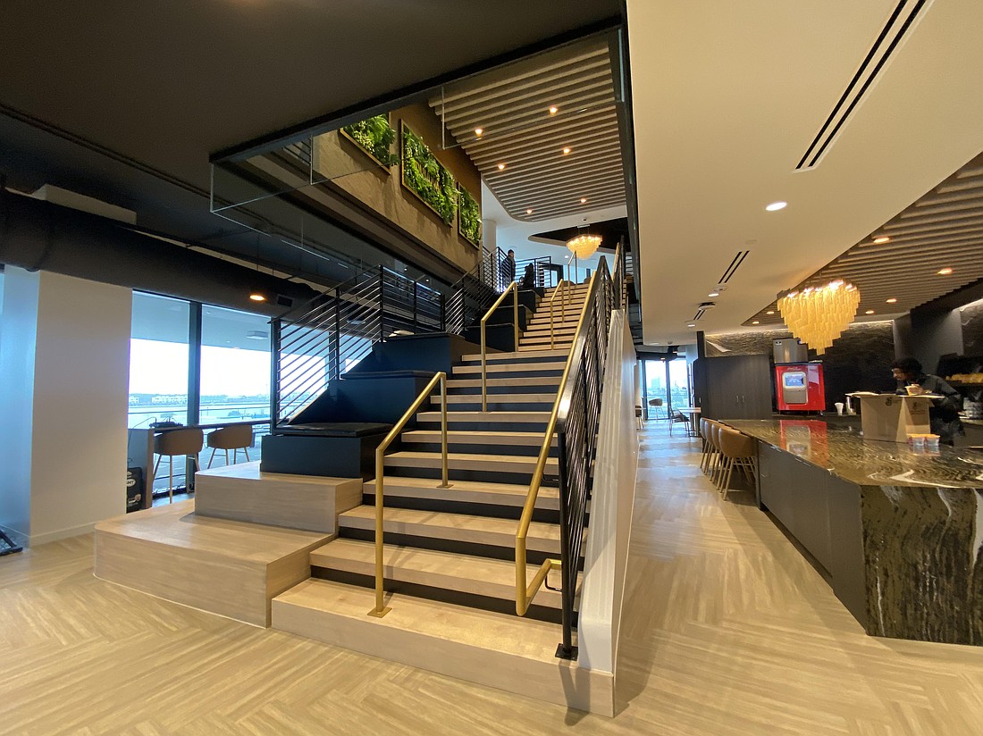 The Jacksonville Jaguars celebrated the opening of their new headquarters, One Tower Court, on March 25. Attendees at a ribbon-cutting received a tour of the six-story office building, including a "social stairway" connecting employee commons areas on the second and third floors.