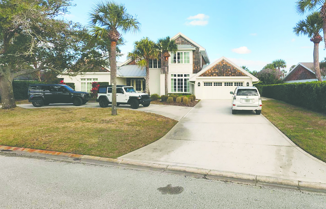 Waterfront home features three bedrooms, two full bathrooms, one half-bathroom, porches, a pool and a dock.