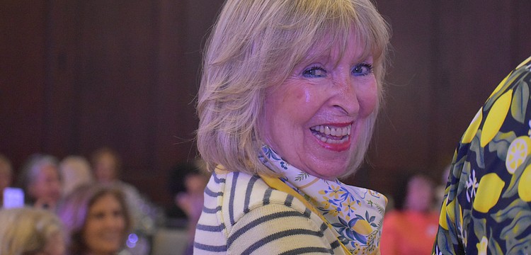 Pam Yulke, modeling an outfit by J. McLaughlin at the "Lights, Camera, Legacy" fashion show, is a past president and has been in the University Park Women's Club for 23 years.