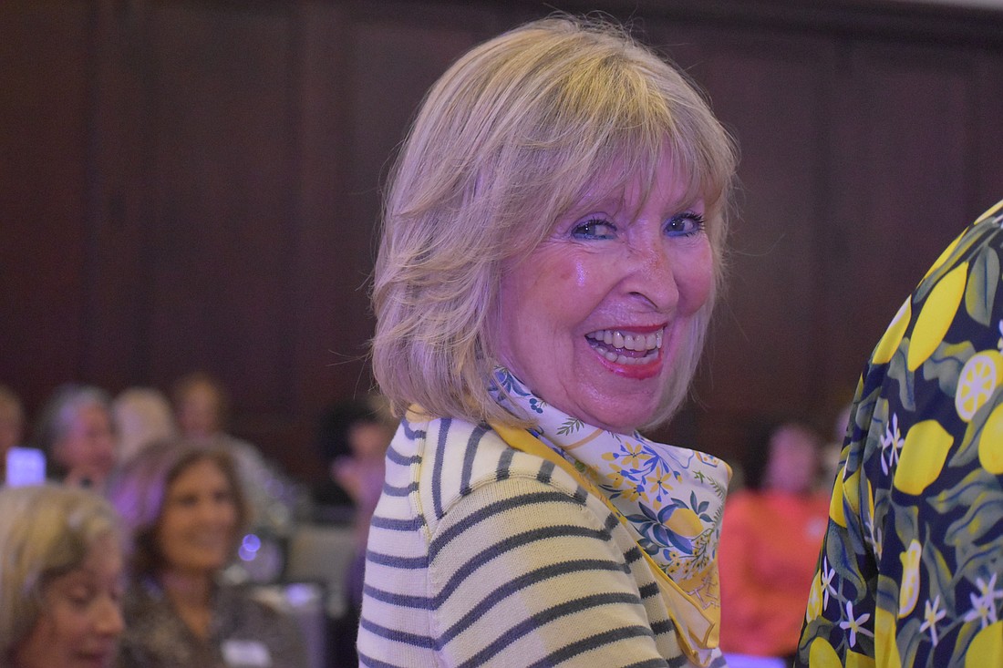 Pam Yulke, modeling an outfit by J. McLaughlin at the "Lights, Camera, Legacy" fashion show, is a past president and has been in the University Park Women's Club for 23 years.