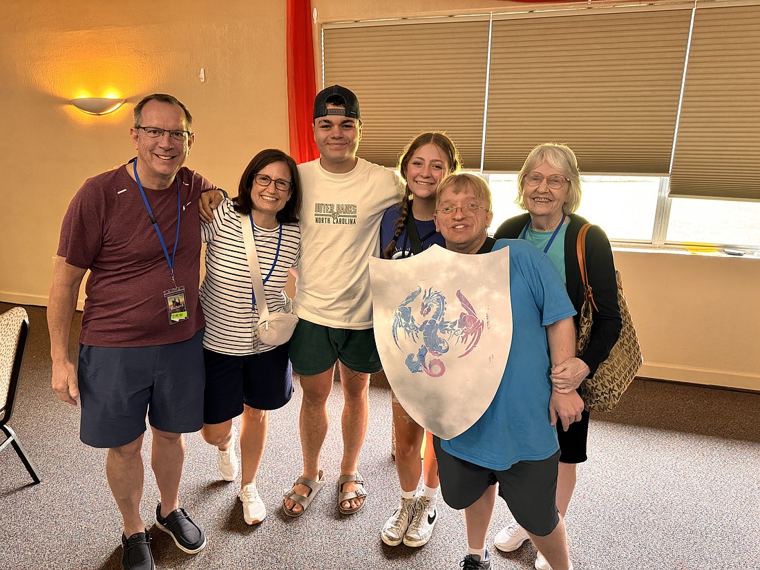 Richard and Terri Schon, left, and Alex Schon and Sharon Hartten, right, were able to enjoy time as a family with buddies at Lift Disability’s annual Breakaway Camp Retreat.