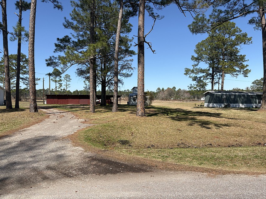 A view of future development planned behind homes built on Jake Road. Structures on Jake Road include mobile homes built on acre-size lots, while future development will include homes with 50-foot lot widths.