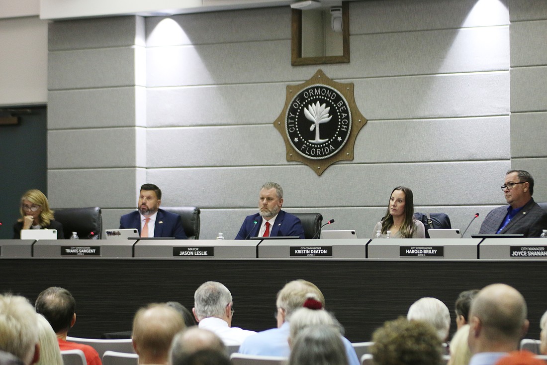 Ormond Beach City Commissioners Lori Tolland, Travis Sargent, Mayor Jason Leslie, Kristin Deaton and Harold Briley listen to Tomoka Oaks residents on March 24. Photo by Jarleene Almenas