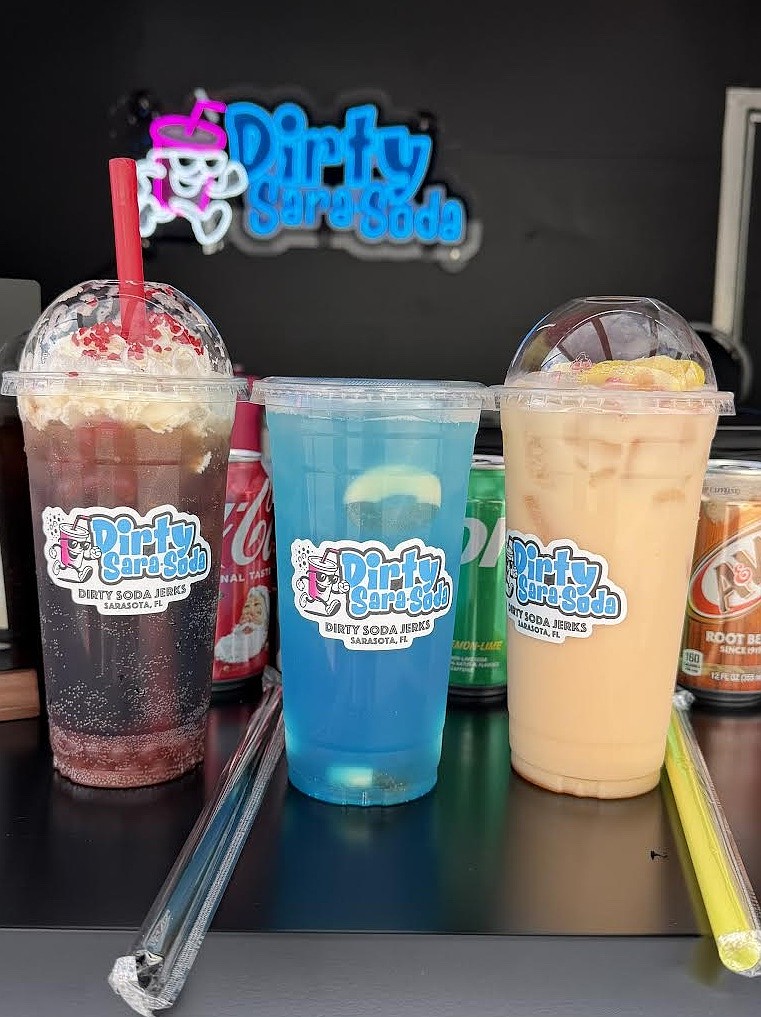 Dirty Sara-Soda offers dirty sodas, build your own sodas, refreshers and lemonades. Most are themed around the Sarasota area. Dirty Sara-Soda offers dirty sodas, build your own sodas, refreshers and lemonades. Most are themed around the Sarasota area.