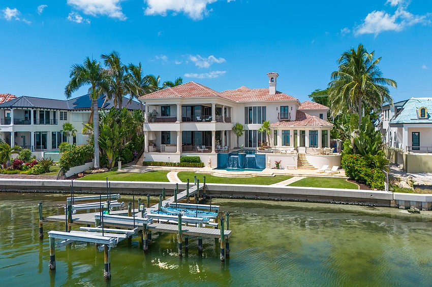 A private dock with boat lifts is located behind the house. A private dock with boat lifts is located behind the house.