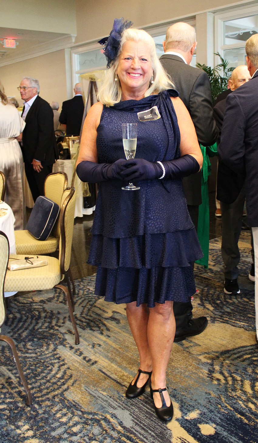 Kari Smith dresses head to toe on theme for the Friars Club dinner.