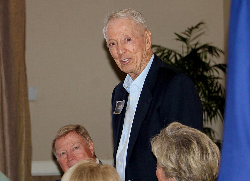 Mark Stratton stands to be recognized with a new award from the Friars Club, a plaque to be displayed at The Tavern and Whiskey Bar at The Longboat Key Club.