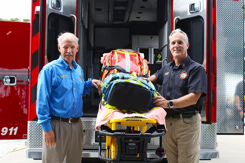 Town Manager Howard Tipton and Longboat Key Fire Rescue Fire Chief Paul Dezzi greet visitors at the March 25 open house, where volunteers gave visitors tours of the rigs and station.