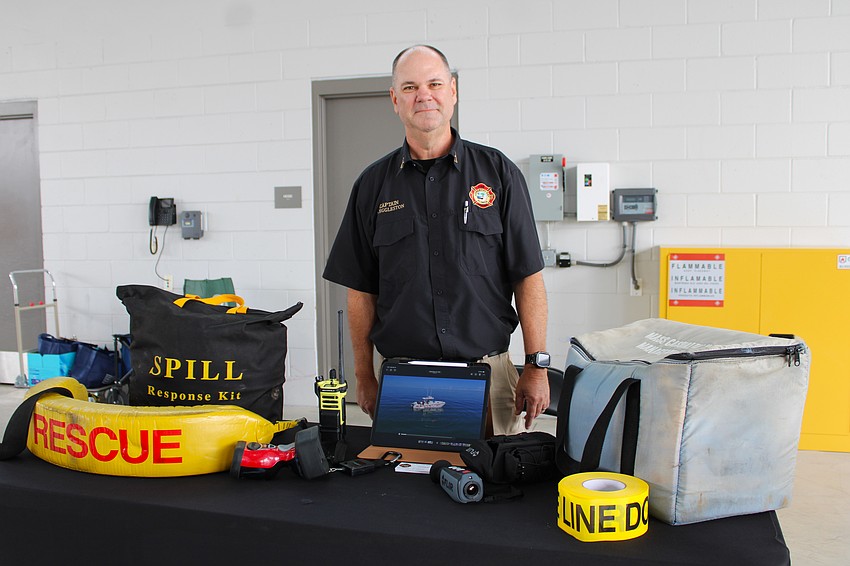 Longboat Key Fire Rescue Training Captain David Eggleston shows some of the department's specialized equipment to visitors at the March 25 open house.