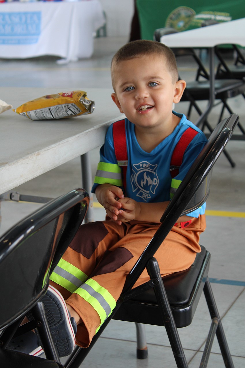 Hagan Lyssy, 2, dressed as a firefighter to meet the first responders of Longboat Key Fire Rescue Station 92 at the recent open house. While he had plenty of favorite moments, getting to see the station's newest ambulance topped the list.