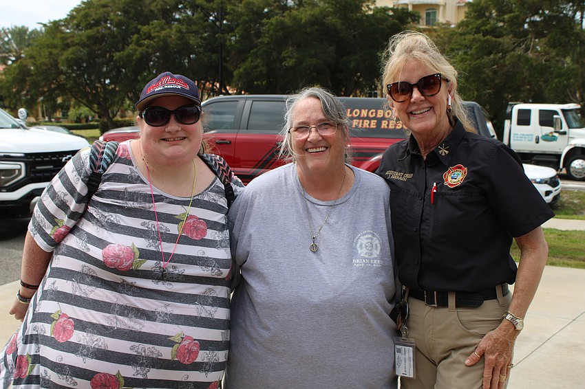 Donna and Pamela Reed greet Longboat Key Fire Rescue Assistant Chief Jane Herrin at the March 25 open house. They remembered the memory of family member Brian Reed, who died April 10, 2001, while on duty as a career firefighter/EMT with West Manatee Fire & Rescue‚ Holmes Beach.