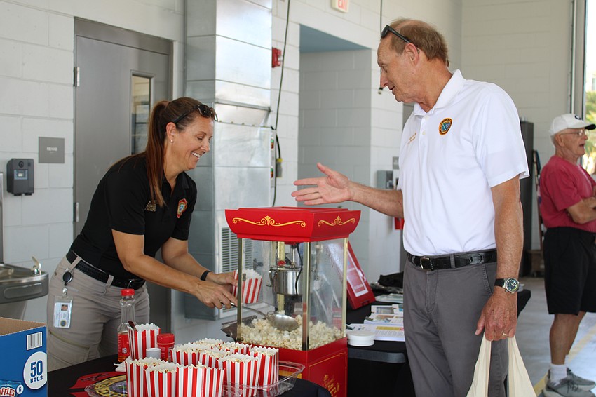 Fire EMS Liaison and PIO Tina Adams and Commissioner Gary Coffin