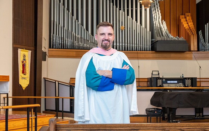 Steven Ball in front of the organ at St. Boniface Episcopal Church, where he directs organ and choral music for the parish’s principal services.