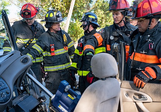 Longboat Key firefighter paramedics used the Hurst Jaws of Life ram to push the dashboard of a Ford Focus away from the passenger seat.