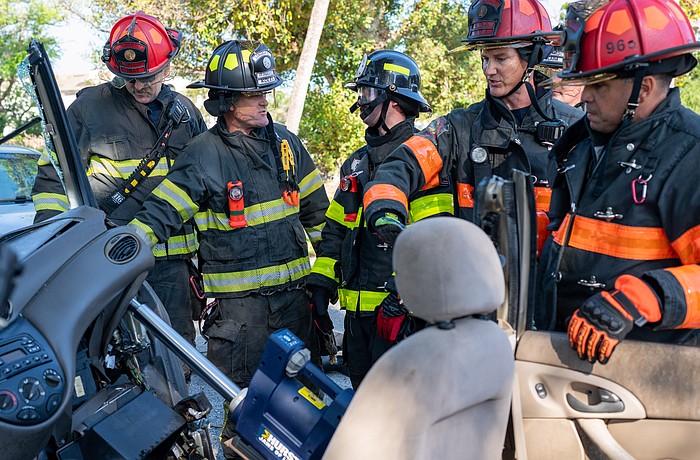 Longboat Key firefighter paramedics used the Hurst Jaws of Life ram to push the dashboard of a Ford Focus away from the passenger seat.