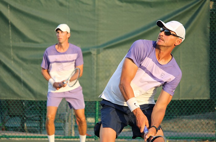 Tennis pros Robert Jendelund and Tomasz Borucki face off in a doubles match against Jhonathan Gonzalez and David Pfister at the Longboat Key Tennis Center's end-of-season party March 25.