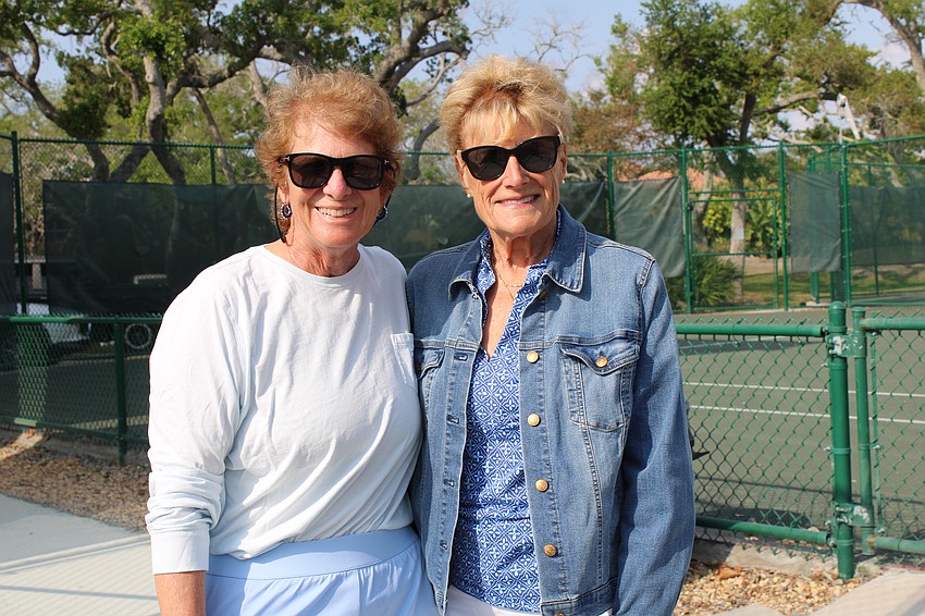 Rebecca Schlecht and team captain Kenda Smith take in the friendly doubles match by the tennis pros. Smith has been captaining for 10 years, and she said her team was pleased to beat their Lakewood Ranch rivals this season.