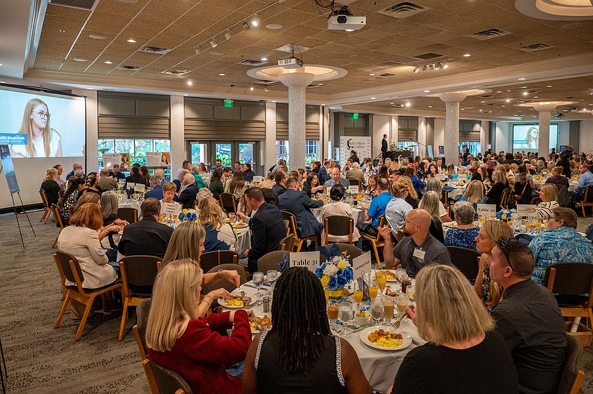 The ballroom was full for breakfast and the program.