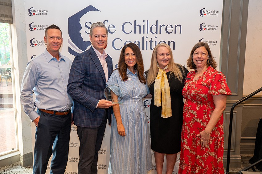 Jeff Speers, Community Foundation CEO Phillip Lanham accepts the Champion For Children Award, Sasha Payette, SCC President and CEO Brena Slater and Jennifer Johnston