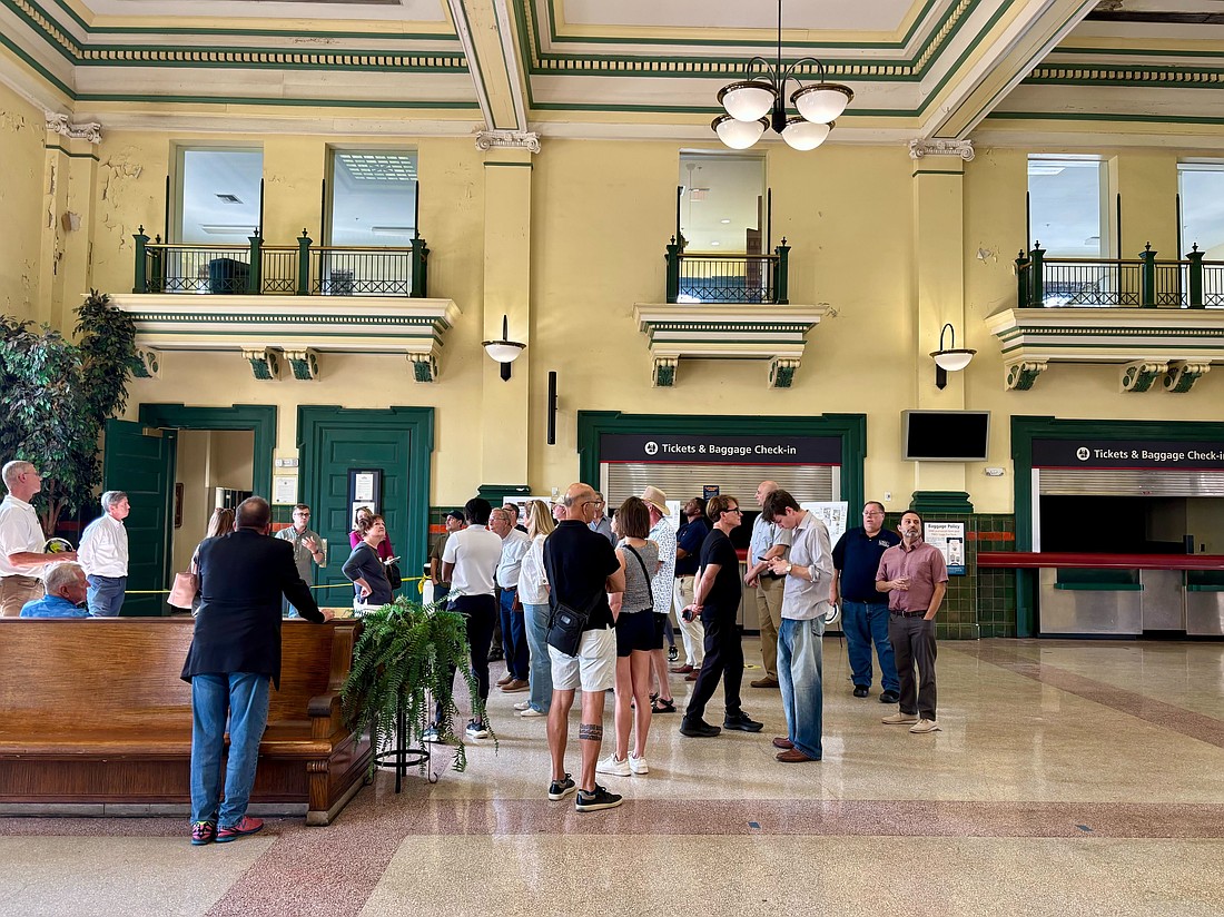 A tour led by the Tampa Bay Community Design Center views interior damage at Tampa Union Station.
