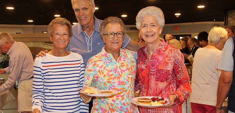 Sue Wertman and Ann Quackenbush join their sister-in-law, Molly Quackenbush, in enjoying a pancake breakfast fundraiser hosted by the Kiwanis Club of Longboat Key. Chris Sachs and fellow Kiwanians volunteers to raise support for Family Promise of Sarasota-Manatee.