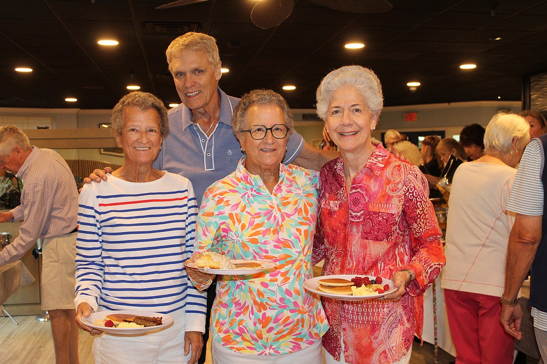 Sue Wertman and Ann Quackenbush join their sister-in-law, Molly Quackenbush, in enjoying a pancake breakfast fundraiser hosted by the Kiwanis Club of Longboat Key. Chris Sachs and fellow Kiwanians volunteers to raise support for Family Promise of Sarasota-Manatee.