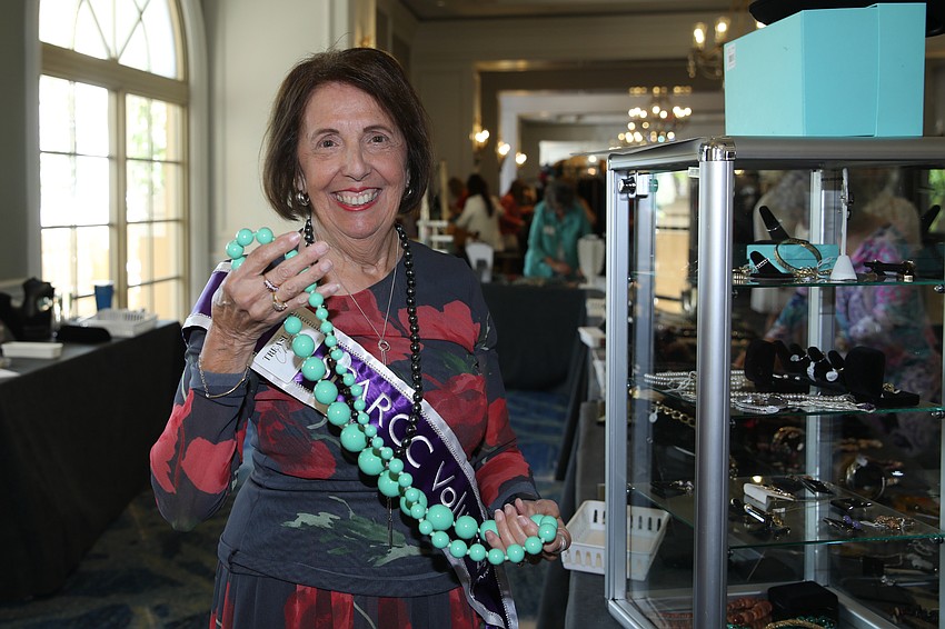 Pat Reinhart shows off some baubles that can be found at the SPARCC Treasure Chest.