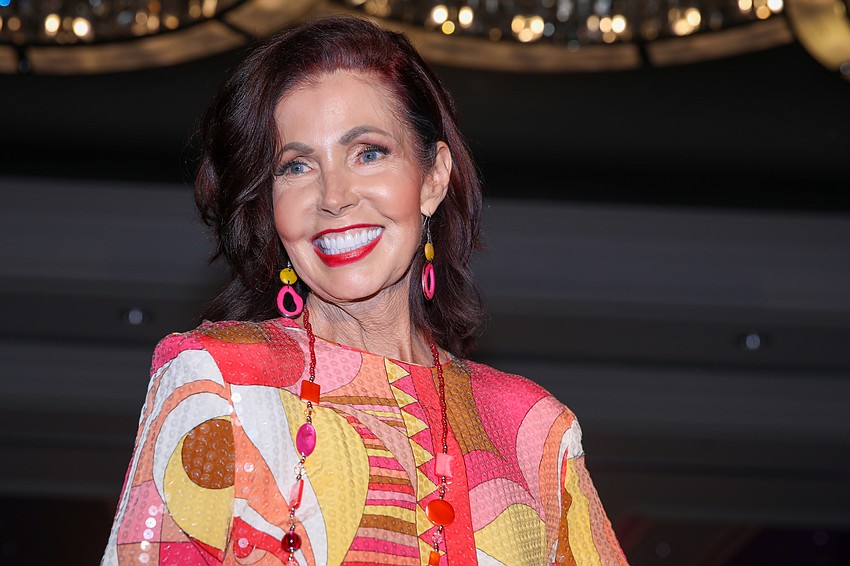 Katherine Pike in a colorful abstract print.