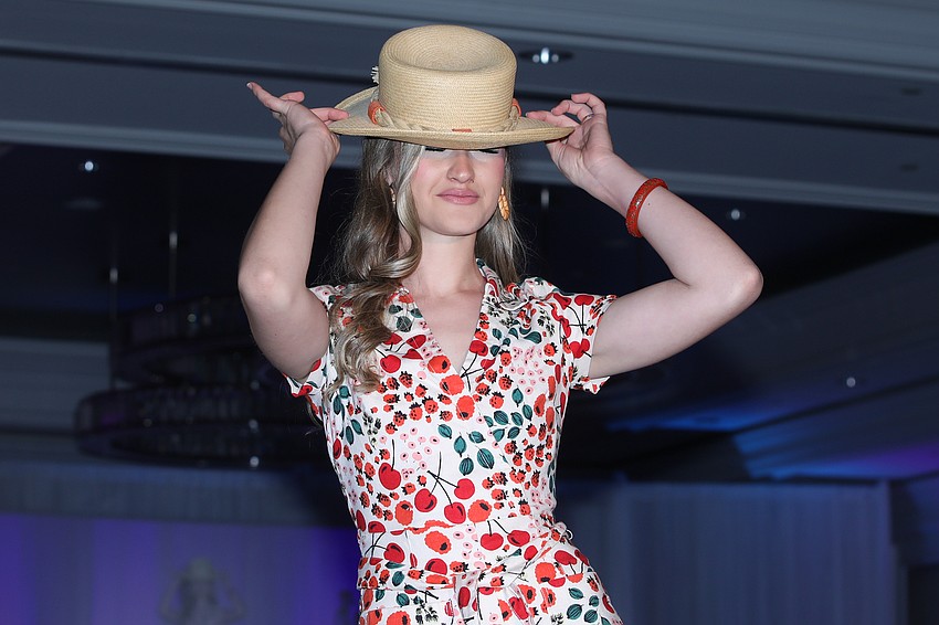 A model shows off a hat during the SPARCC Runway Fashion Show.