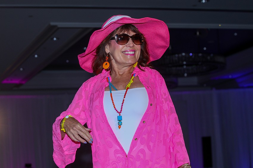 Frantic grabs for sunglasses were witnessed as Melba Ramirez came down the runway in her bright beach pink.