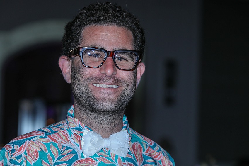 Guest Charlie Shrem cheers on his wife from the sidelines.