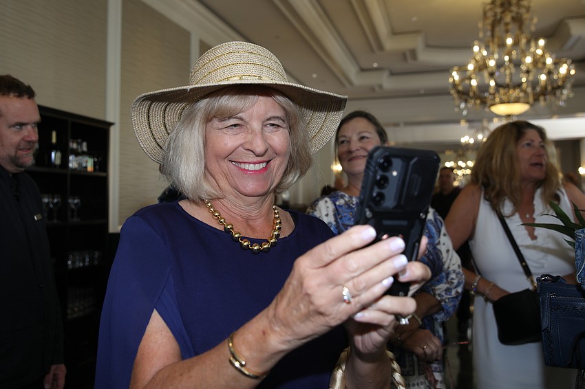 Nathalie Gabel grabs a shot on her cell.