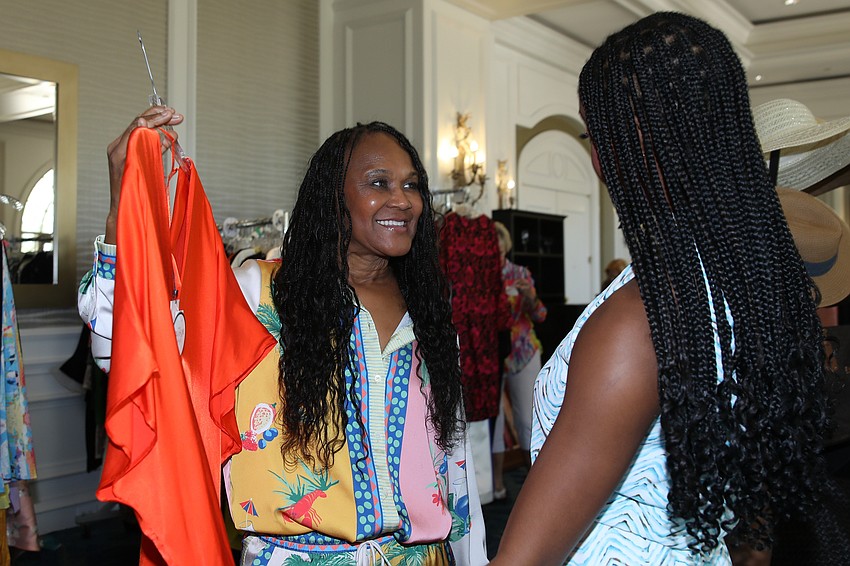 Angela Regnier gets a nod of approval from Faith Adesanya on her potential purchase.