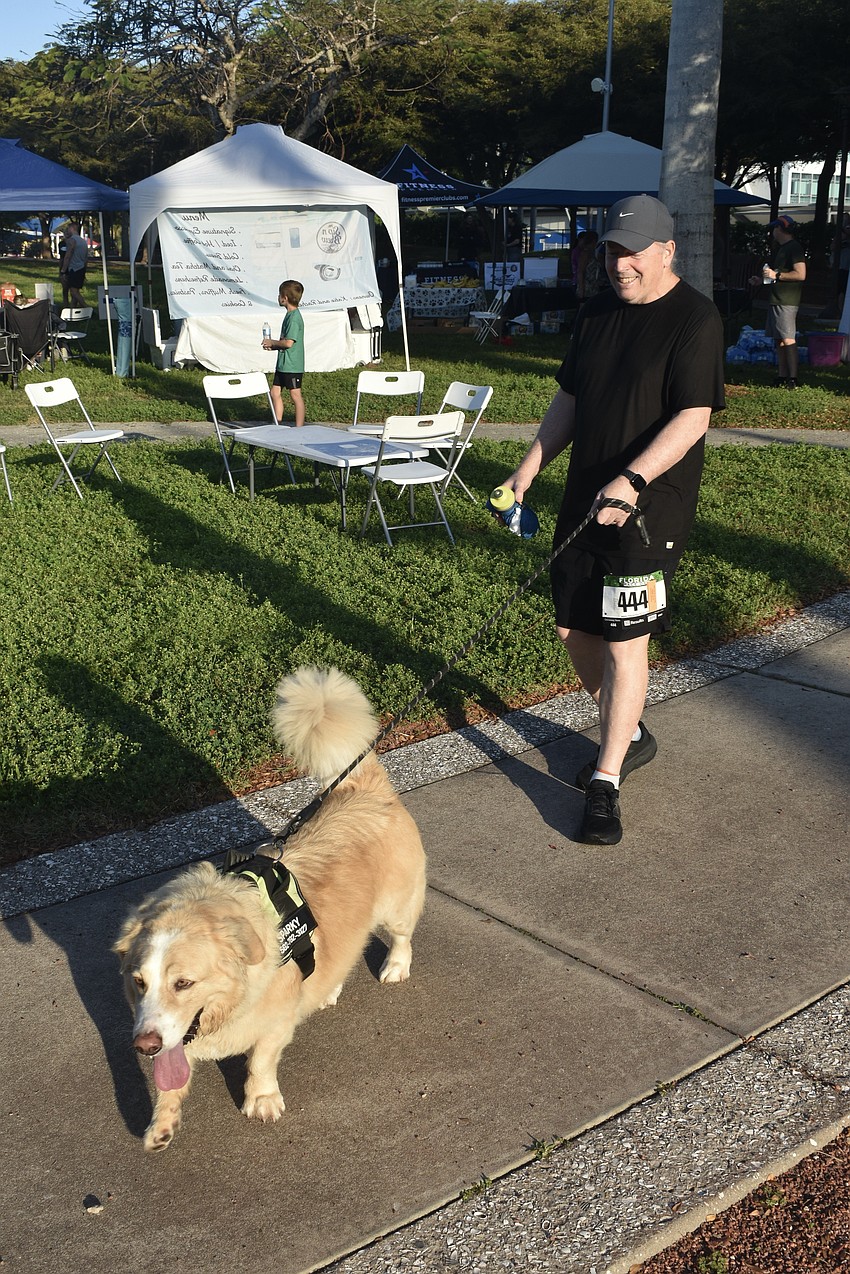 Bobby Durham walks Sparky.